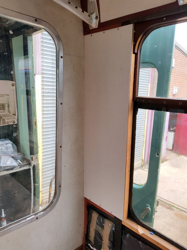 Class 100: Installing a wall panel in the first class section