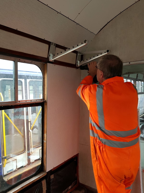 Class 100: Installing a wall panel in the first class section