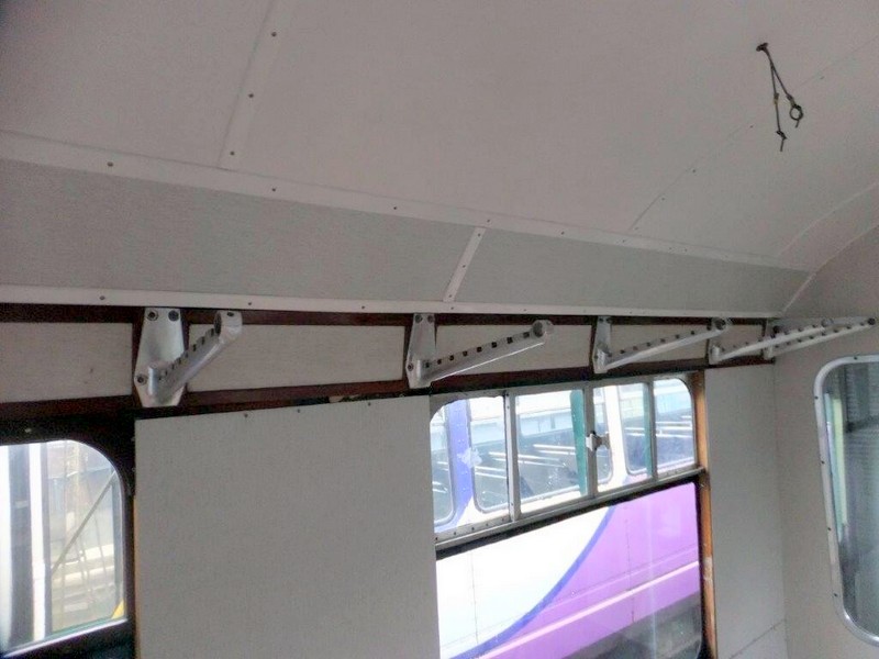 Class 100:Beading installed above the luggage rack backing panels in the first class section