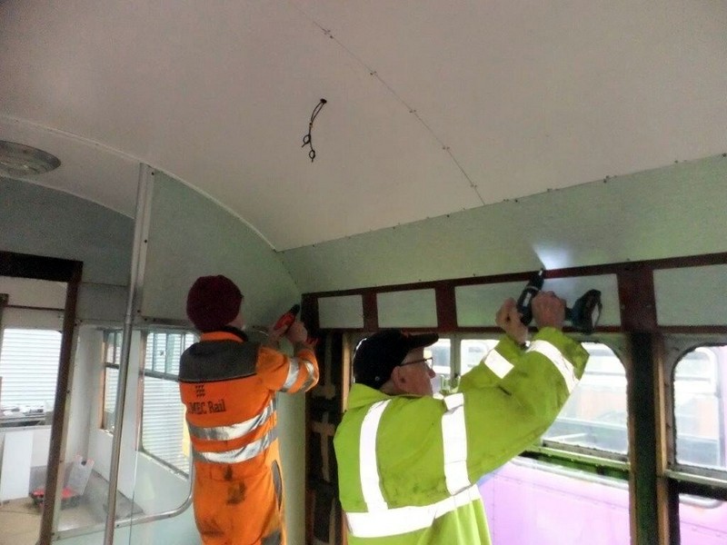 Class 100:Fitting a new wall panel above the luggage rack panels