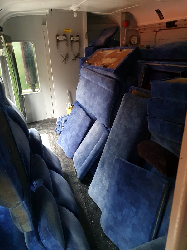Class 108: Worn seat covers stacked in guard's compartment