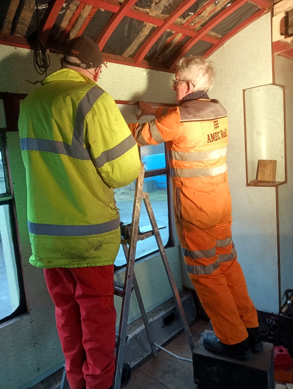 Class 100: Fitting a wall panel above the luggage rack