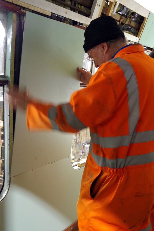 Class 105: Installing a wall panel on the driver's side of the rear compartment