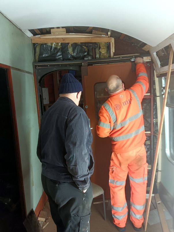 Class 105: Fitting the bolts that secure the sliding end door to its track